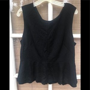 Sleeveless black top/gold zipper down the back